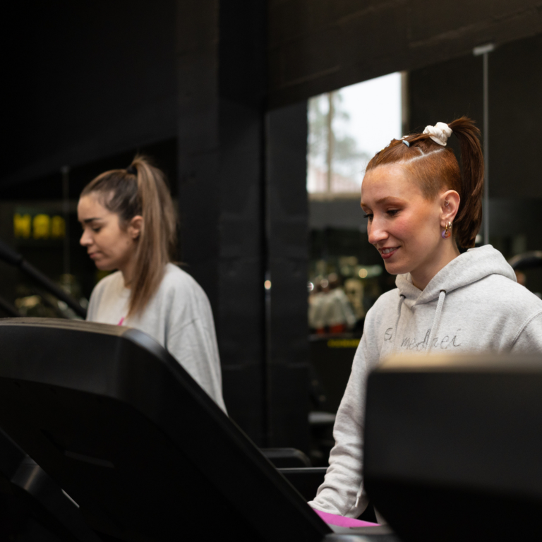 Young people exercising on treadmills, promoting inclusive fitness, confidence and lifelong physical activity.
