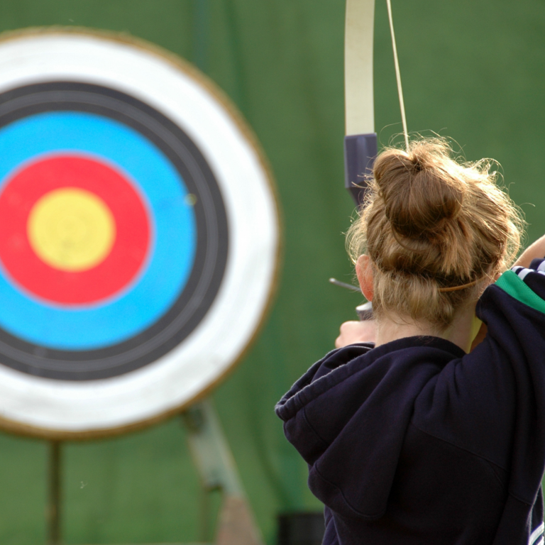 Building confidence through inclusive archery and outdoor activities Young person practising archery, developing confidence, focus and physical skills through inclusive activity.